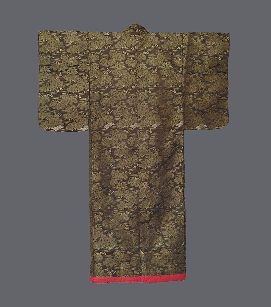 Ornate golden Japanese kimono with leaf pattern and red trim