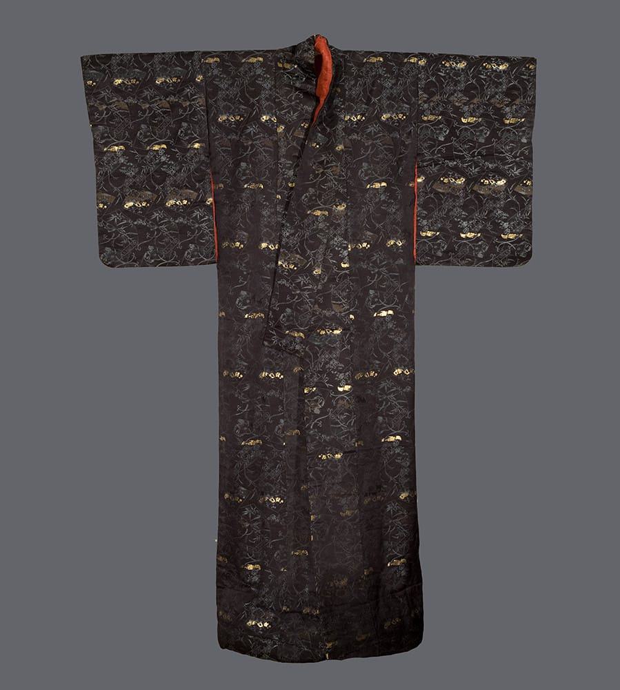 Black Japanese kimono with gold floral pattern and red trim