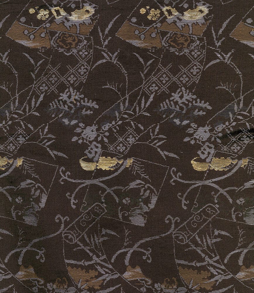 Dark brown textile with intricate floral and geometric patterns in gold