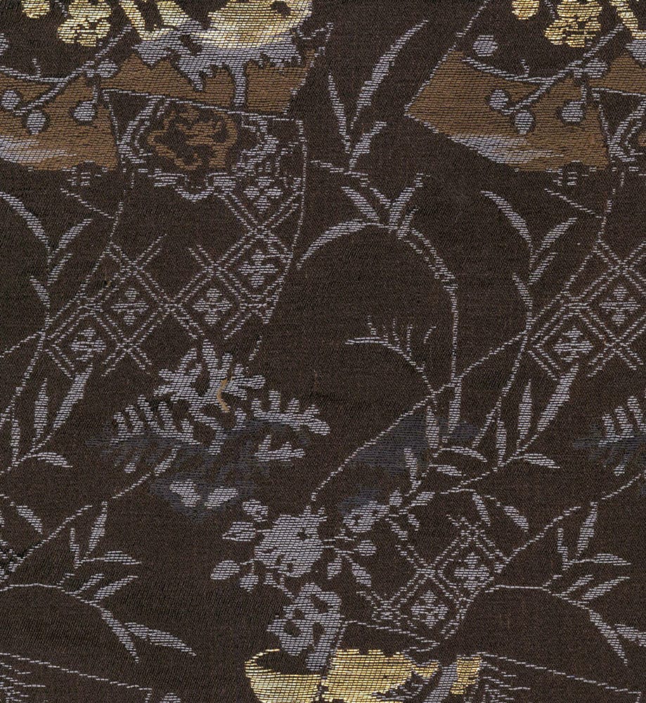 Intricate dark brown textile with gold and silver floral pattern