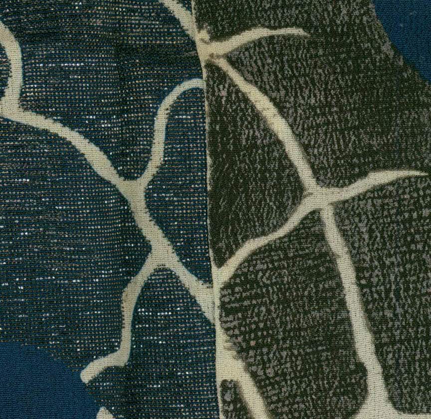 Abstract textile with organic blue-green pattern and white connecting lines