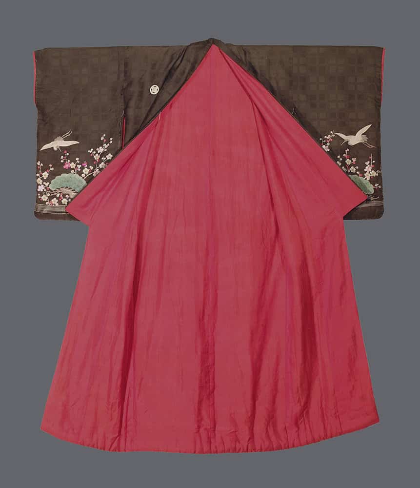 Traditional Japanese kimono in pink and brown with bird and flower details