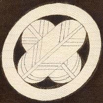 Traditional Japanese mon design with geometric leaf pattern in circle