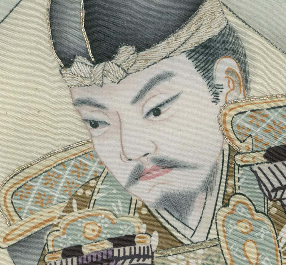 Traditional Japanese textile artwork of a figure in ornate clothing