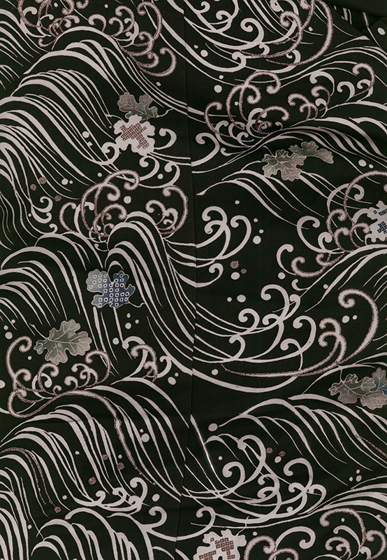 Intricate black and silver swirling pattern with delicate floral motifs