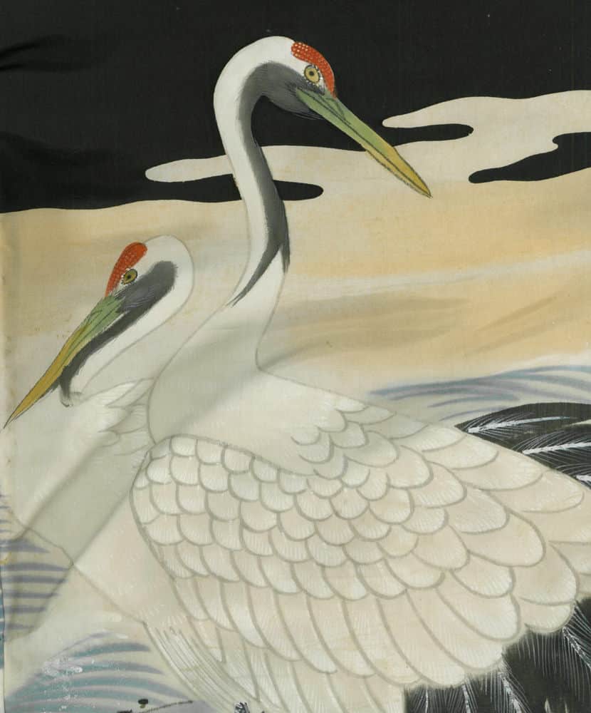 Two white cranes with red-capped heads standing together in artistic illustration