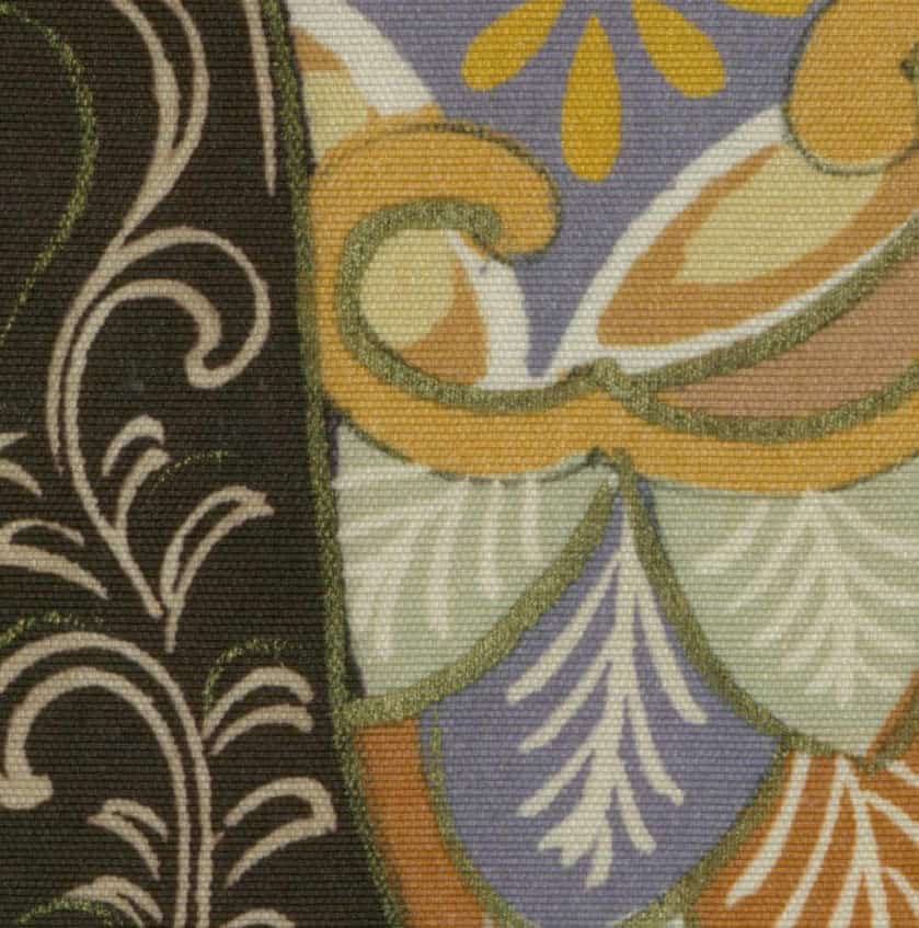 Decorative fabric with swirling floral patterns in earth tones