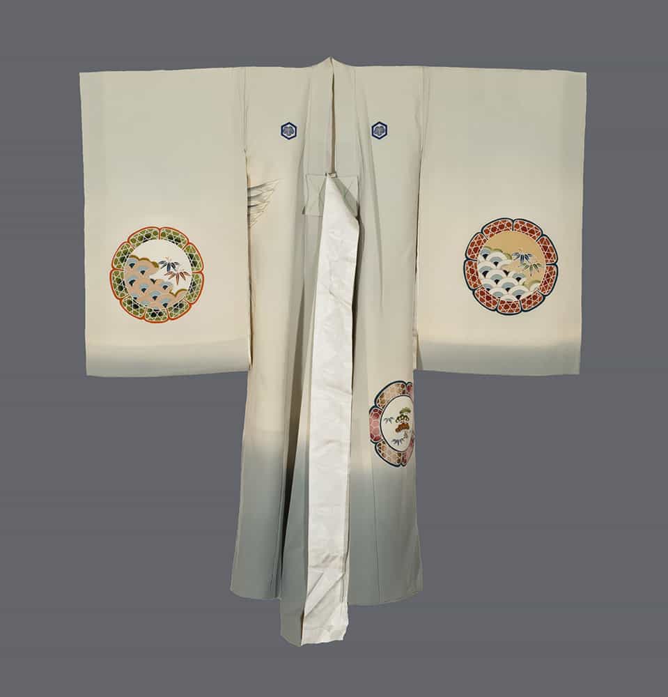 Pale green Japanese kimono with decorative circular medallions and bamboo motifs
