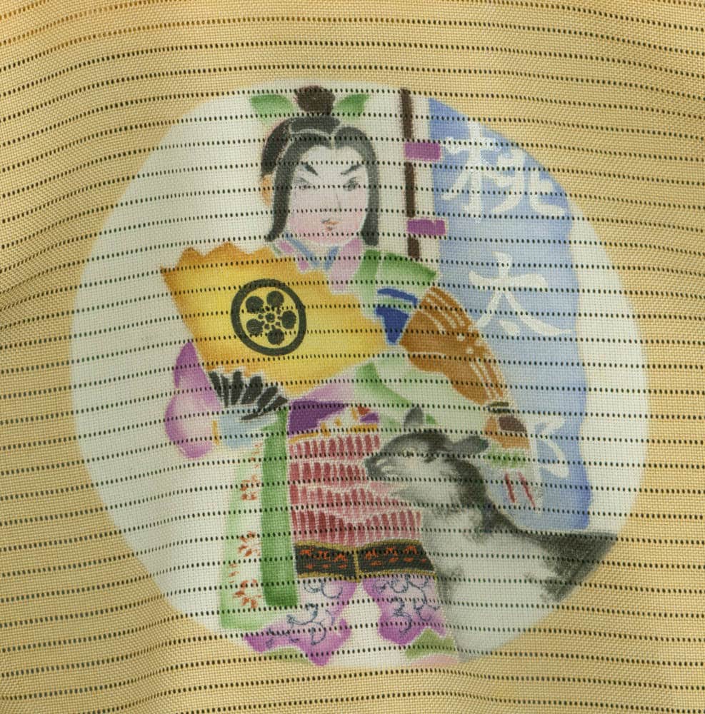 Japanese geisha in colorful kimono holding traditional round fan