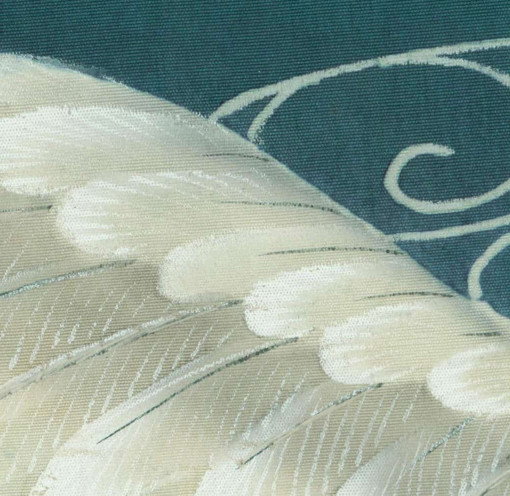 Abstract soft white curves on textured teal and beige fabric background