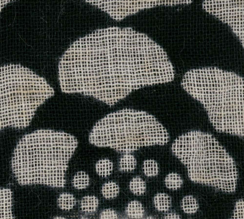 Textured fabric with black and beige woven geometric pattern