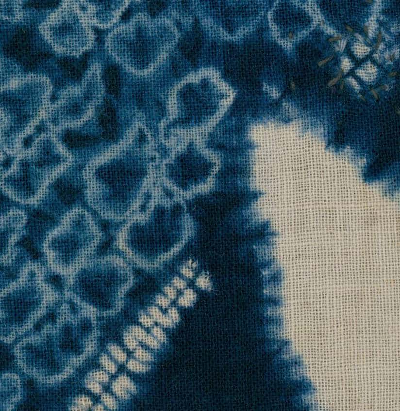 Blue and white shibori tie-dye fabric with intricate pattern