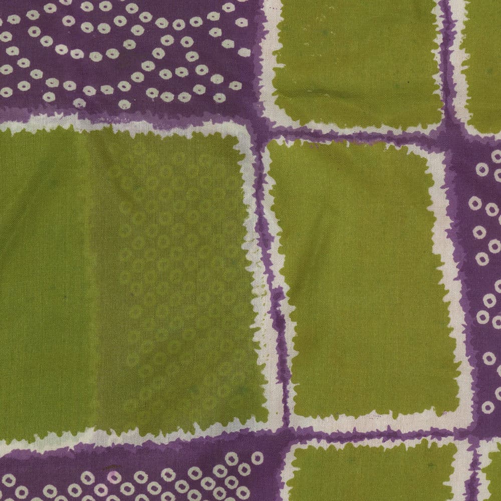 Fabric pattern with green squares and purple borders with dotted accents