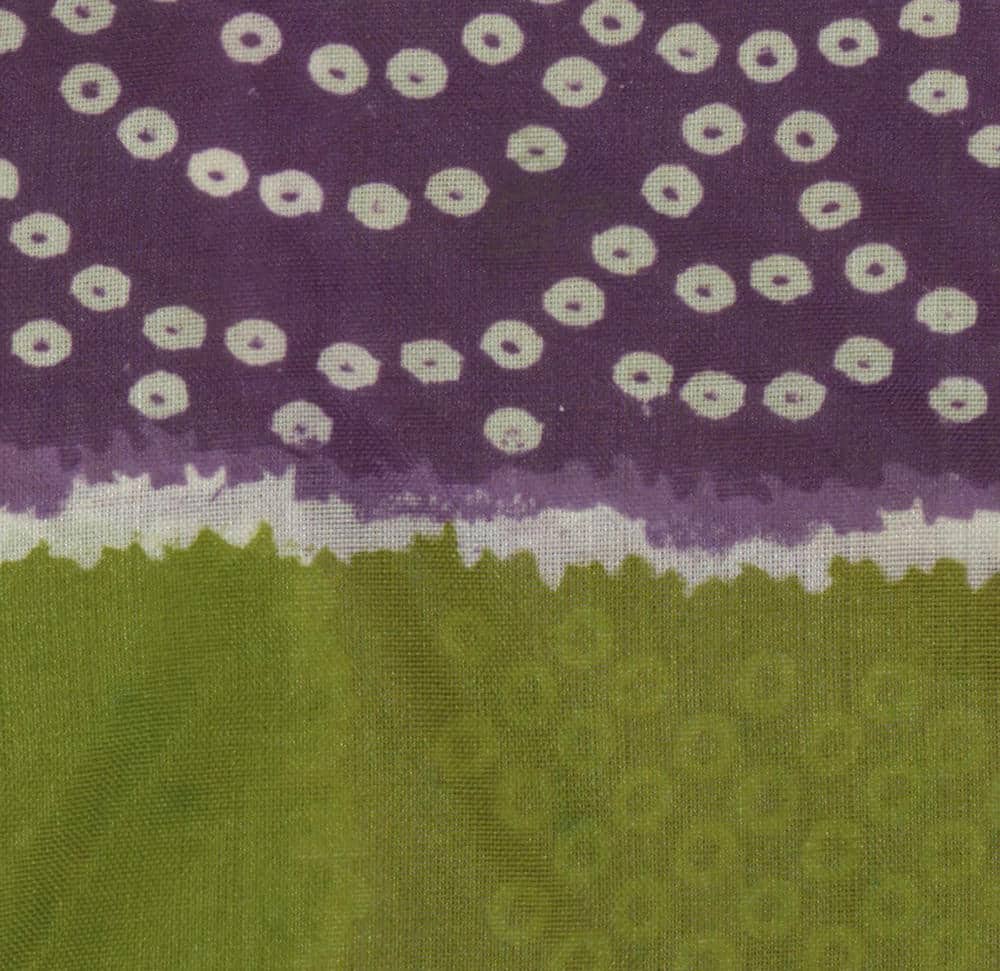Purple and green textile with light cream scattered ring pattern