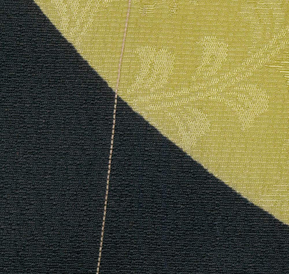Black and yellow textured fabric with diagonal geometric stitching line