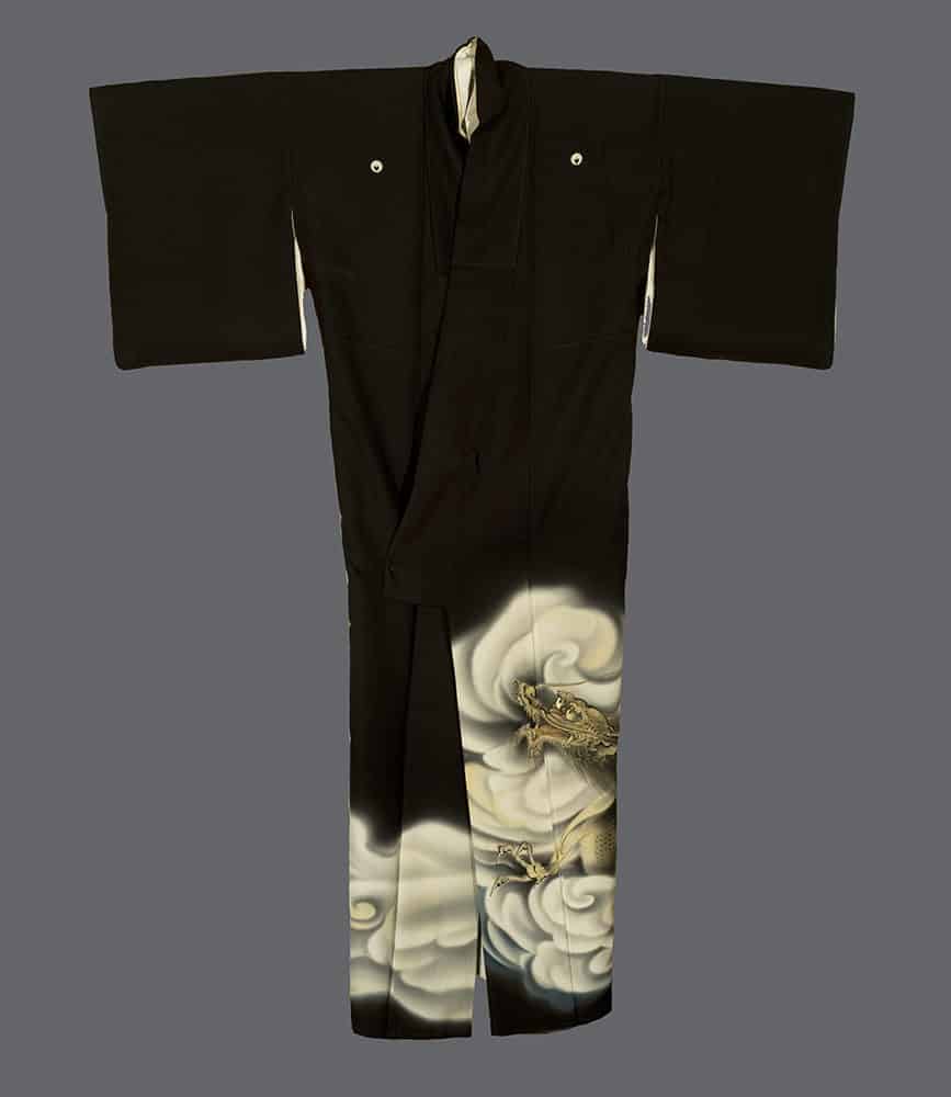 Black Japanese kimono with gold dragon amid swirling clouds