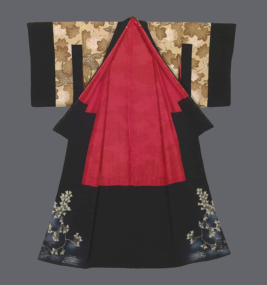 Traditional Japanese kimono with red panel and leaf-patterned sleeves