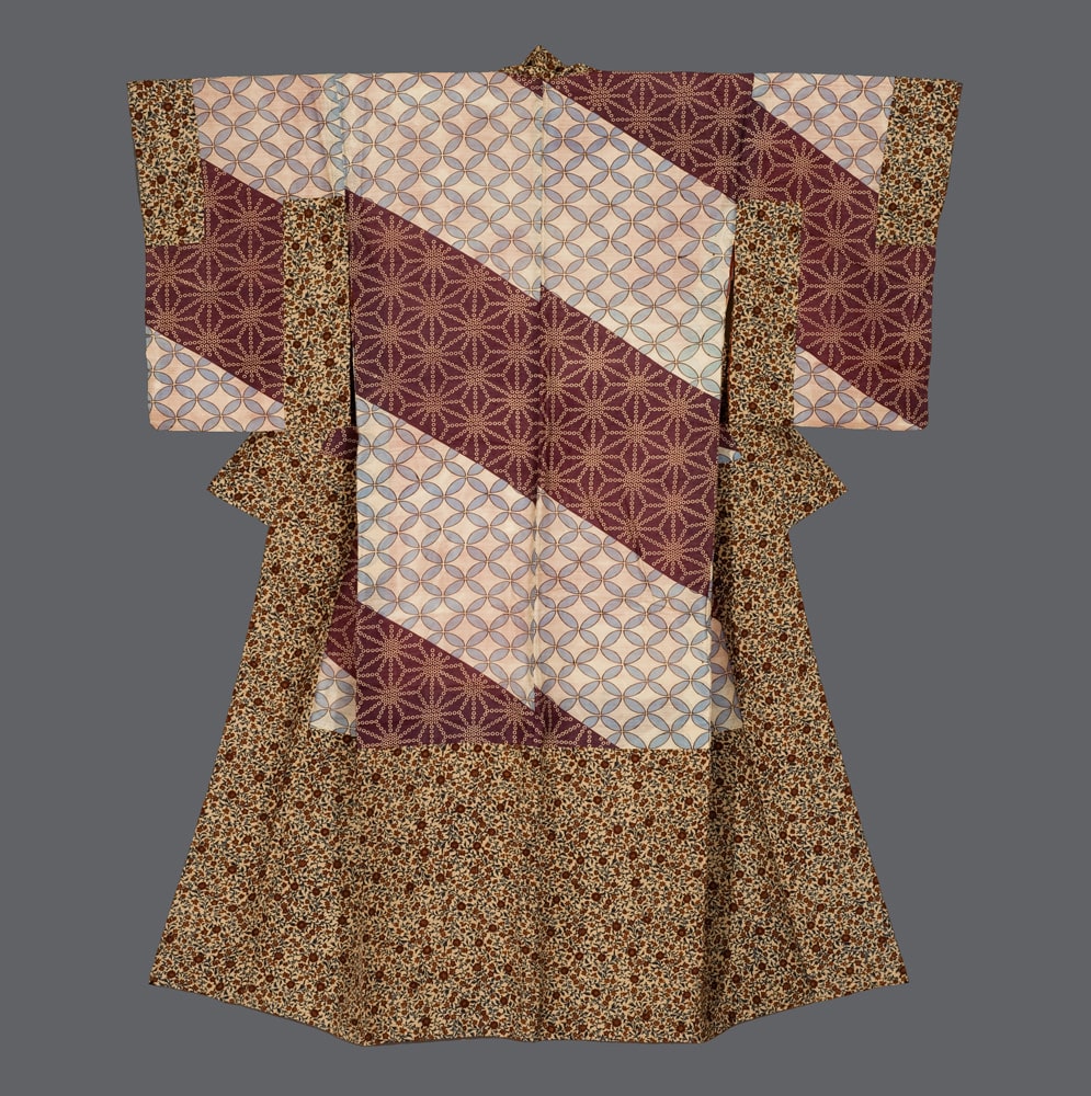 Traditional Japanese kimono with geometric patterns in burgundy, beige, and brown