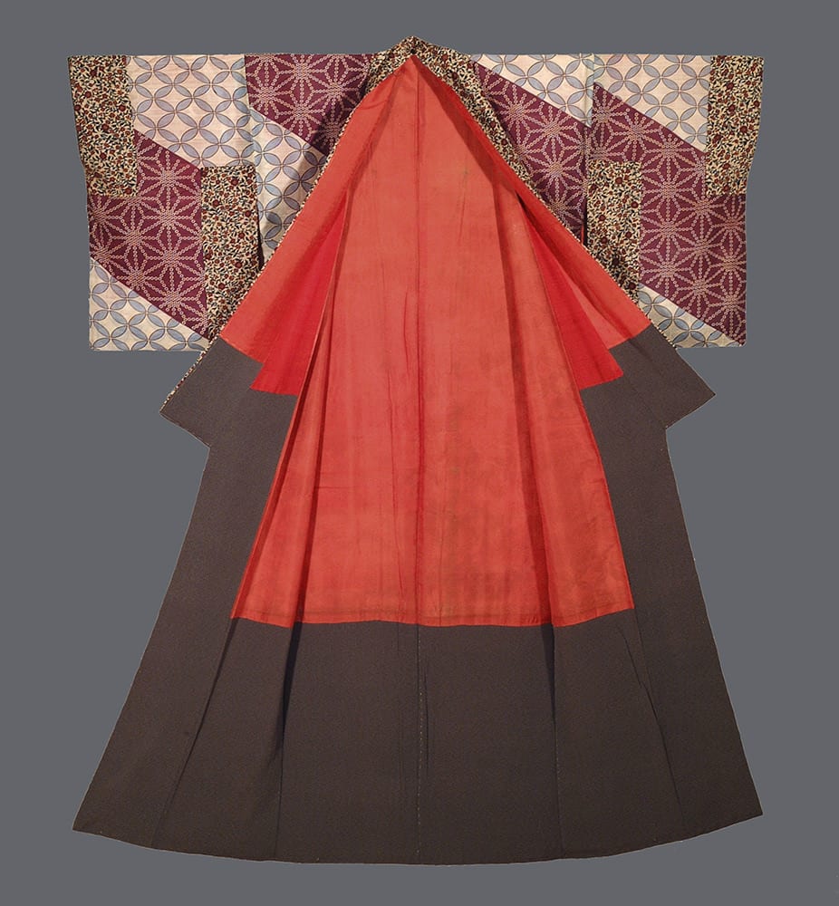 Colorful Japanese kimono with red, brown, and patterned geometric sleeves