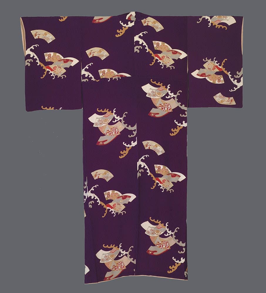 Purple Japanese kimono with decorative fan and wave pattern