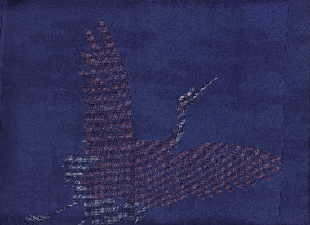 Pixelated bird silhouette with spread wings on deep blue background