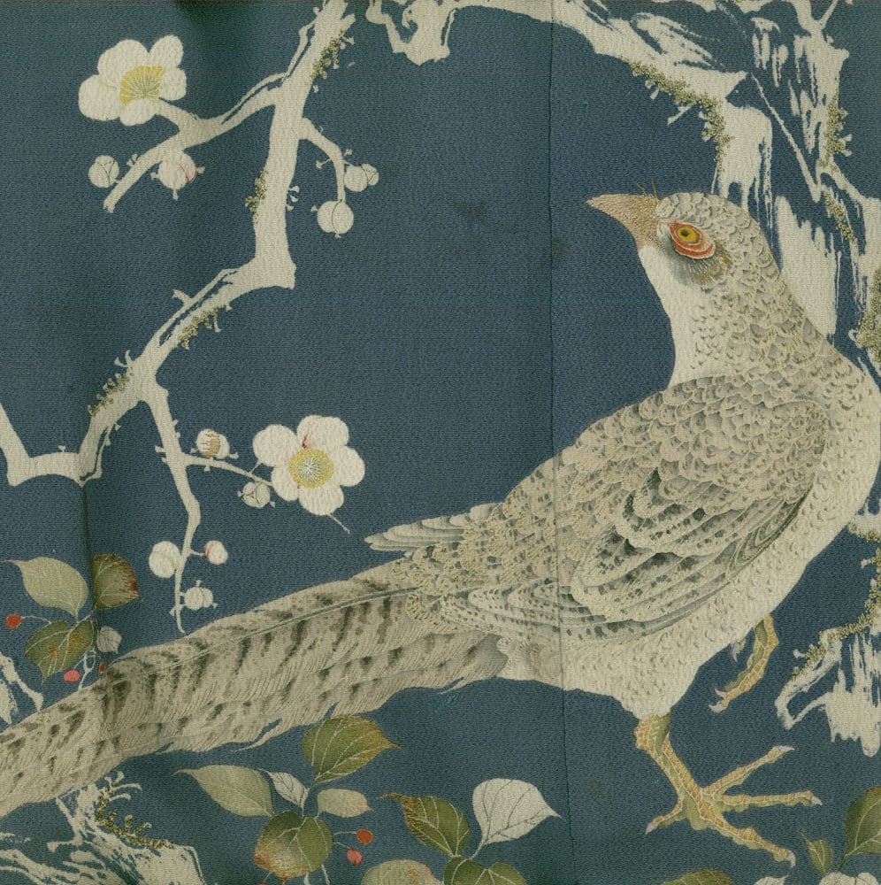 Vintage illustration of two birds perched among blossoming branches and leaves