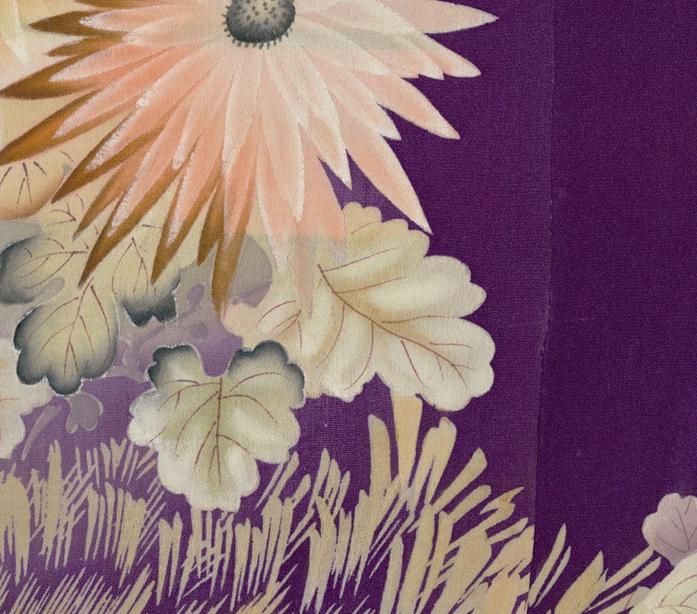 Delicate pale flower with blush tones against a deep purple background