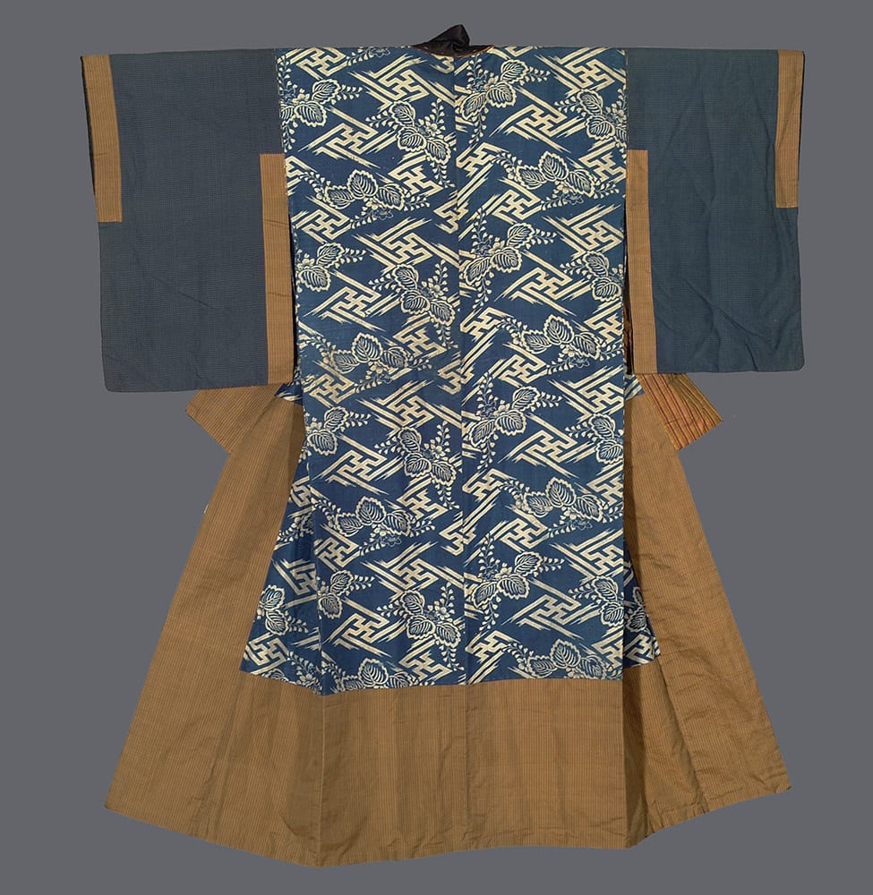 Traditional Japanese kimono with blue geometric pattern and tan borders