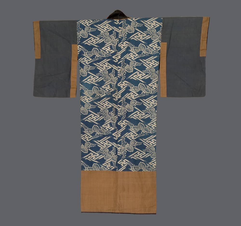 Traditional Japanese kimono with blue geometric floral pattern and tan borders