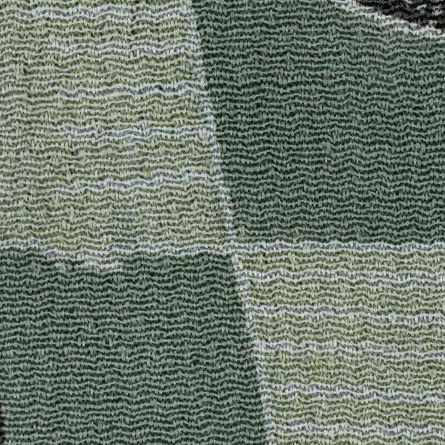 Green and white textured fabric with woven herringbone or chevron pattern