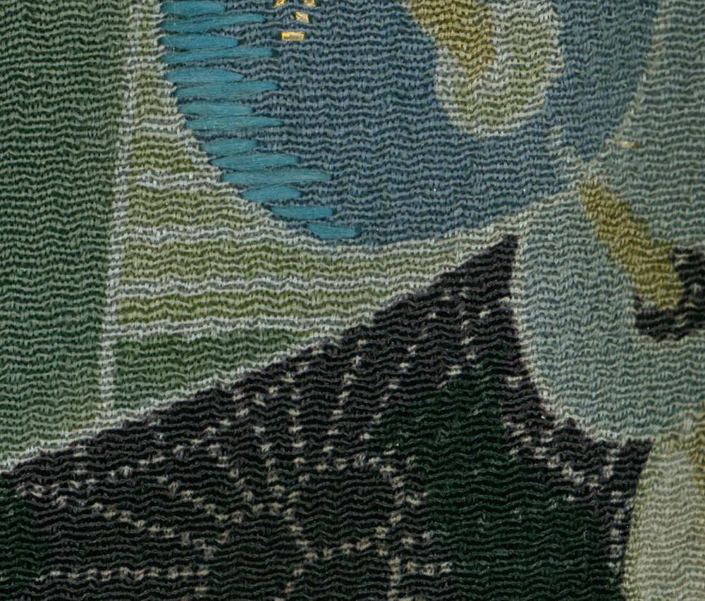 Abstract textile with wavy green and blue geometric pattern