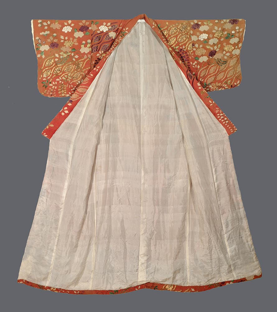 Elegant Japanese kimono with white body and ornate orange floral sleeves