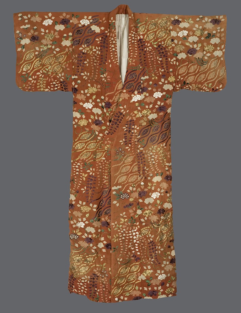Ornate rust-colored Japanese kimono with floral and leaf patterns
