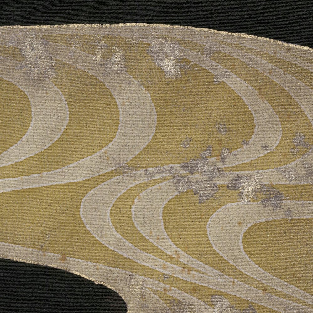 Wavy gold and beige abstract textile pattern with curved lines