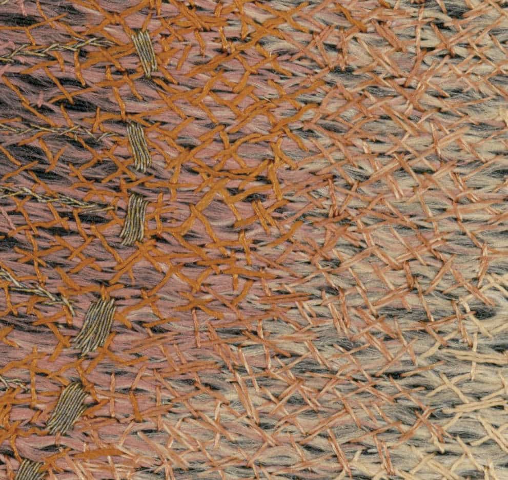 Intricate woven texture with orange and brown interlacing threads