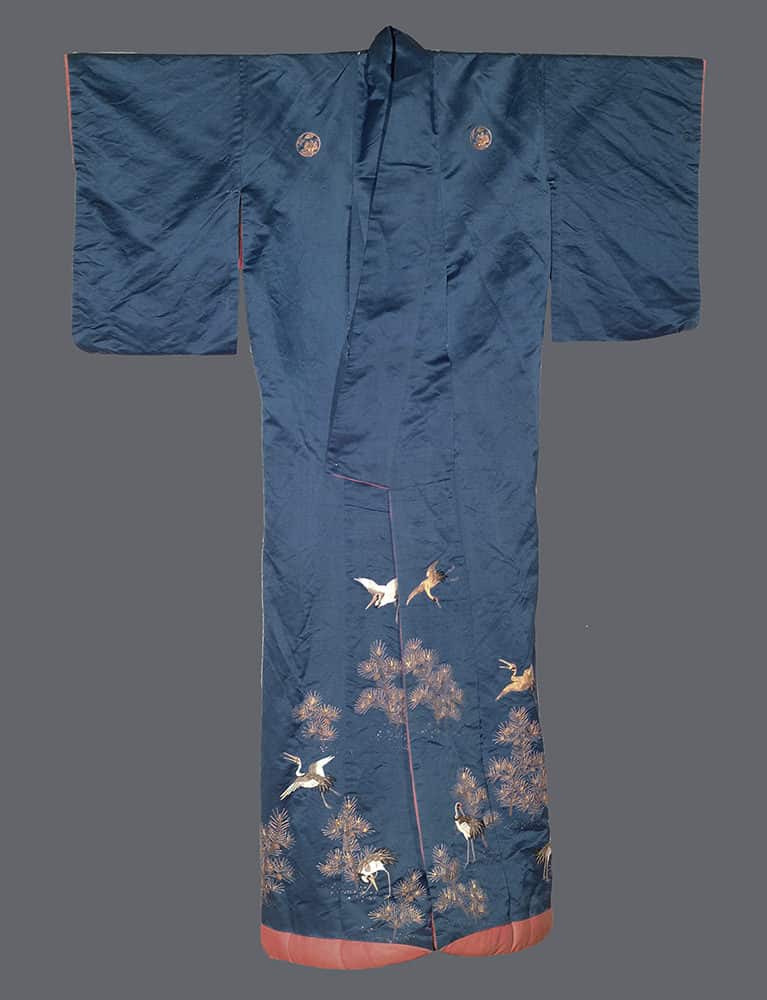 Blue Japanese kimono with white cranes and pine trees embroidered