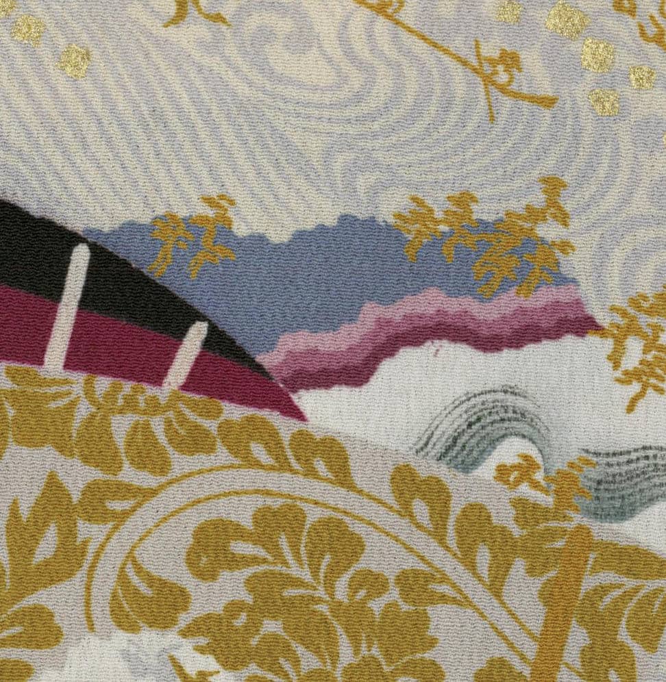Textured fabric with golden floral patterns, waves, and abstract landscape elements