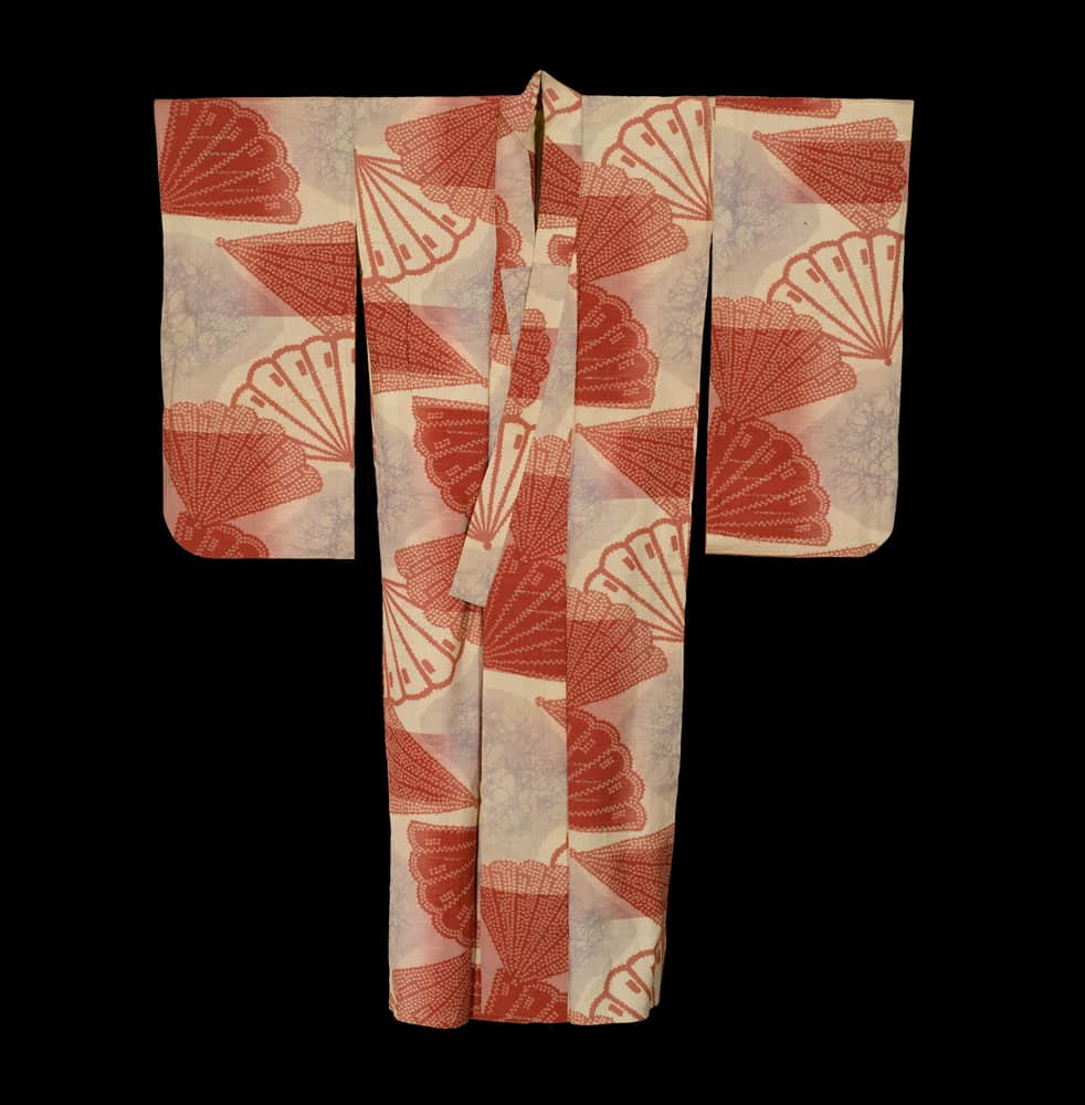 Vintage Japanese kimono with red fan pattern on light background