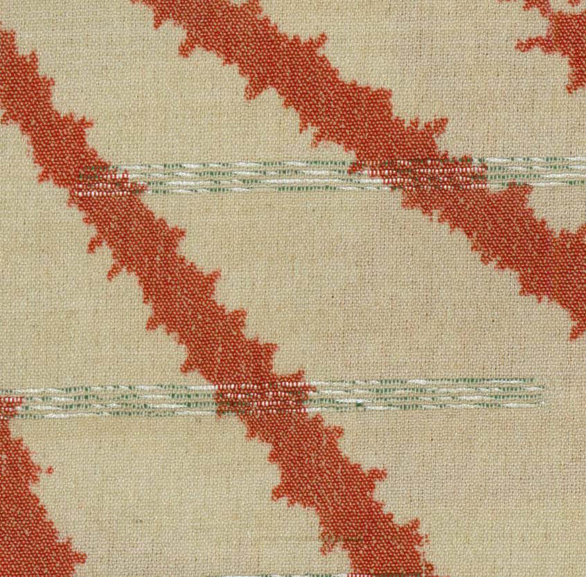 Rust red abstract pattern on beige textured woven fabric