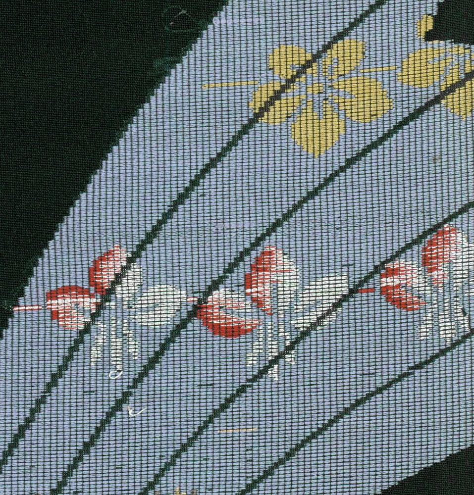 Yellow dragonfly and red flowers on textured blue-gray background