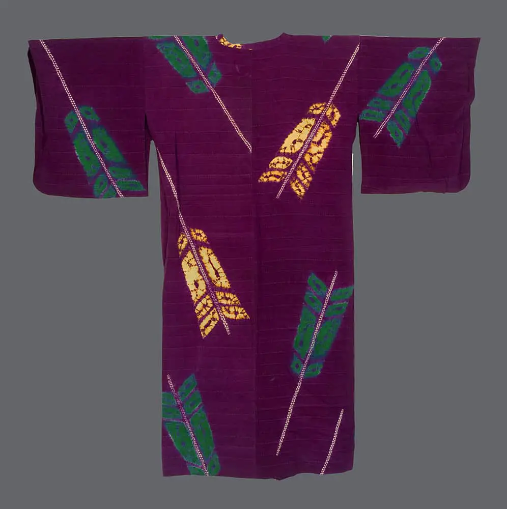 Silk michiyuki with shibori‑dyed yabane motifs in golden yellow and teal on a rich burgundy ground, arranged in bold diagonal Art Deco‑influenced geometry 