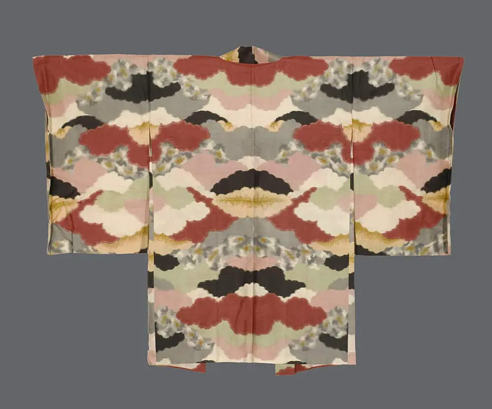 A 1950s meisen silk haori with a bold, rhythmic pattern of abstract red, black, and green cloud forms.