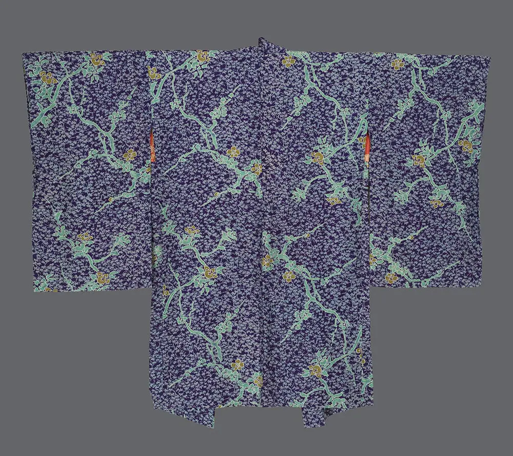 Indigo-purple jiginu silk haori featuring a dense all-over pattern of green plum blossoms, citrus, and maple leaves.