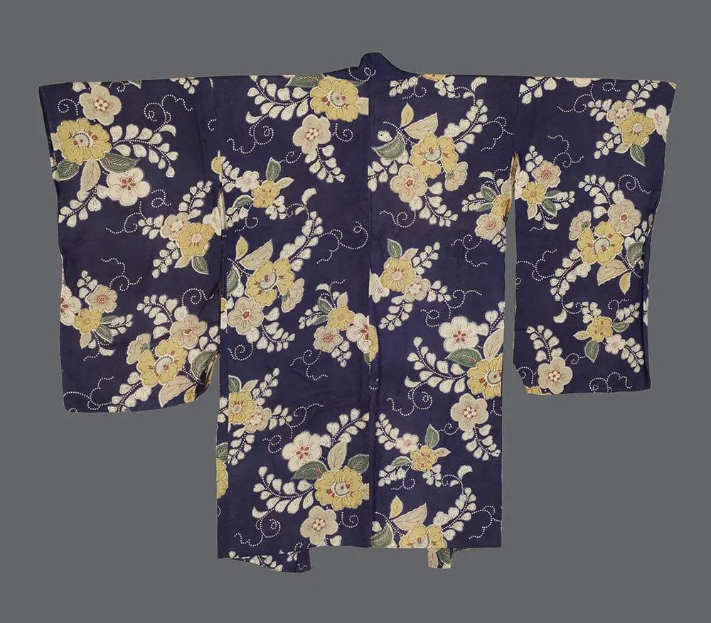 Navy-blue rinzu silk haori featuring silkscreened yellow and cream flowers with swirling white-dotted vine patterns.