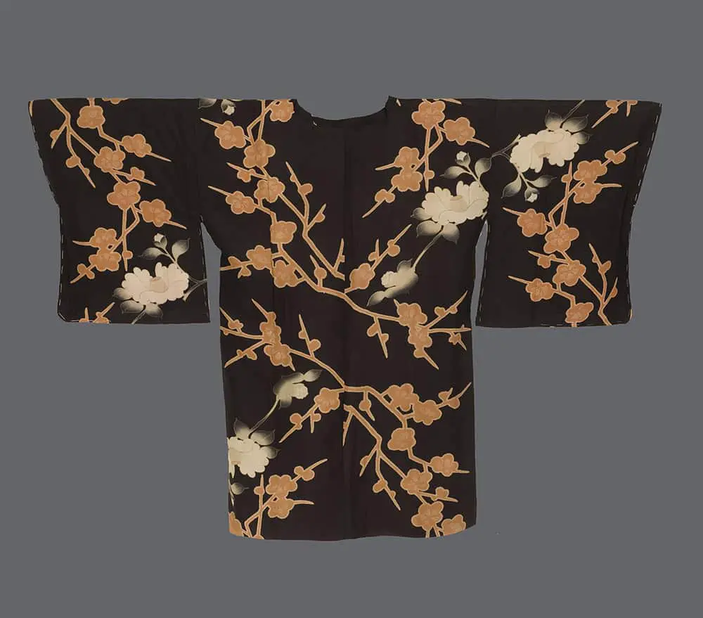 Black silk michiyuki with ochre plum blossom branches and white peonies featuring a squared front collar.