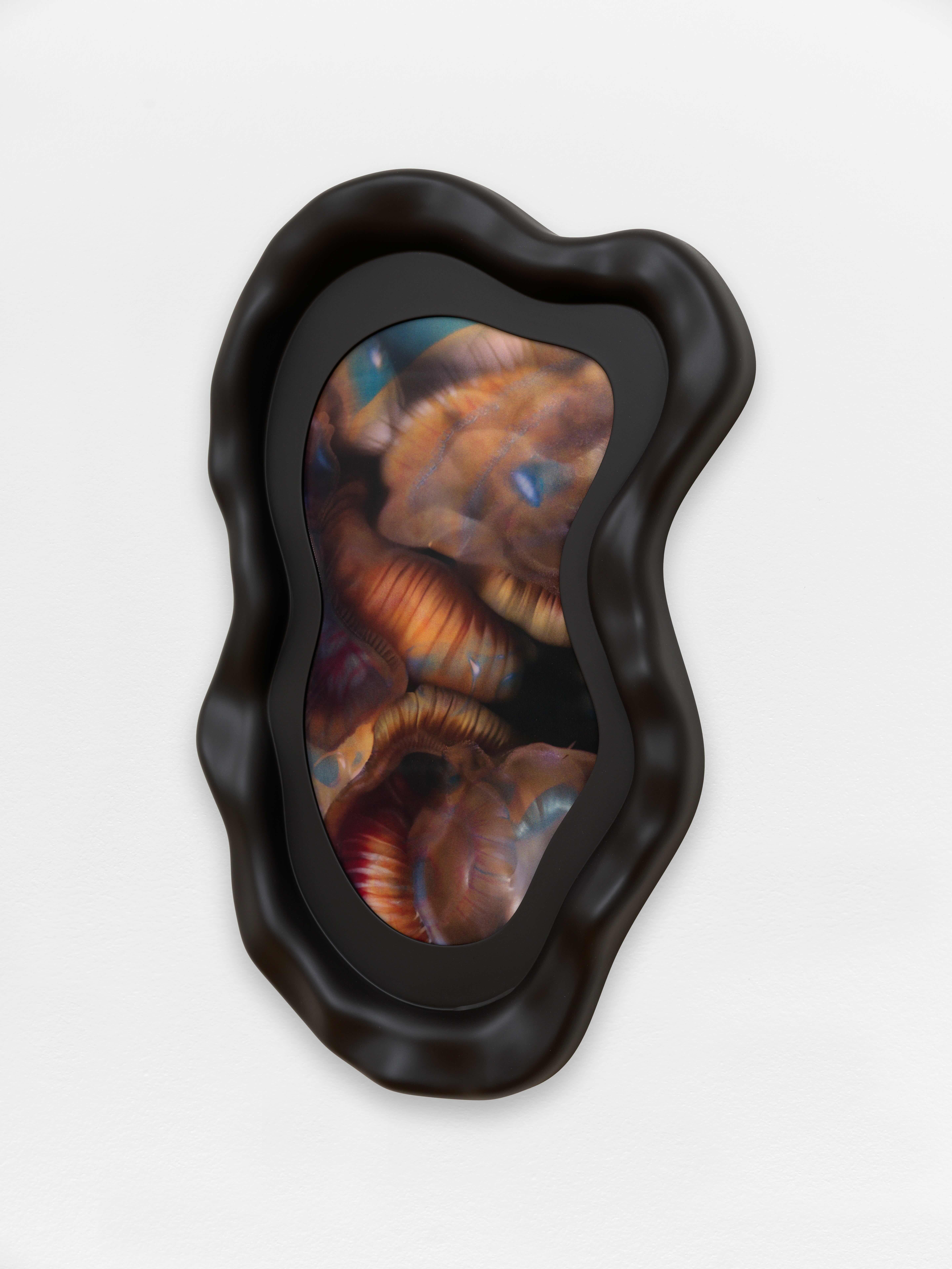 An abstract artwork in an organic matte black frame.