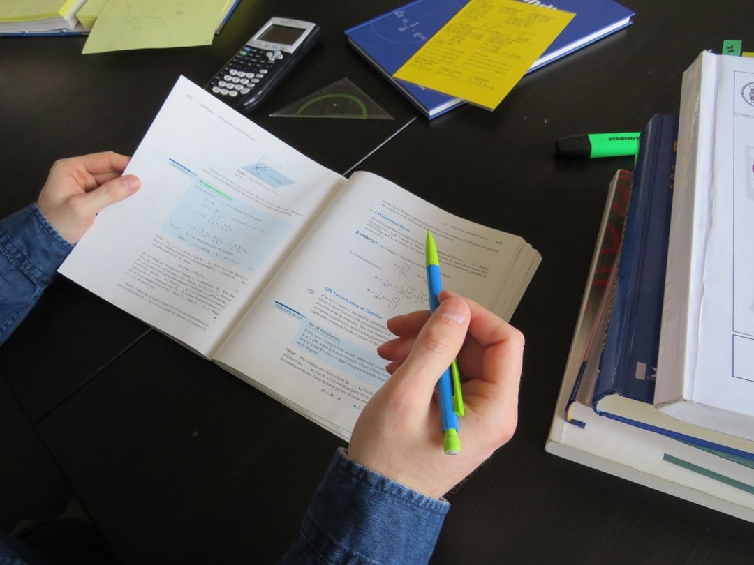 A desk with a calculator