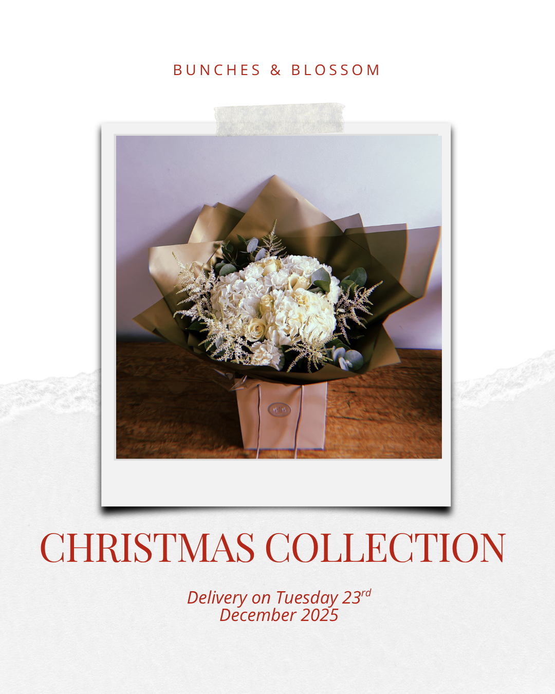 This beautiful festive bunch combines white roses, hydrangea, puffy carnations, astilbe and seasonal foliages.