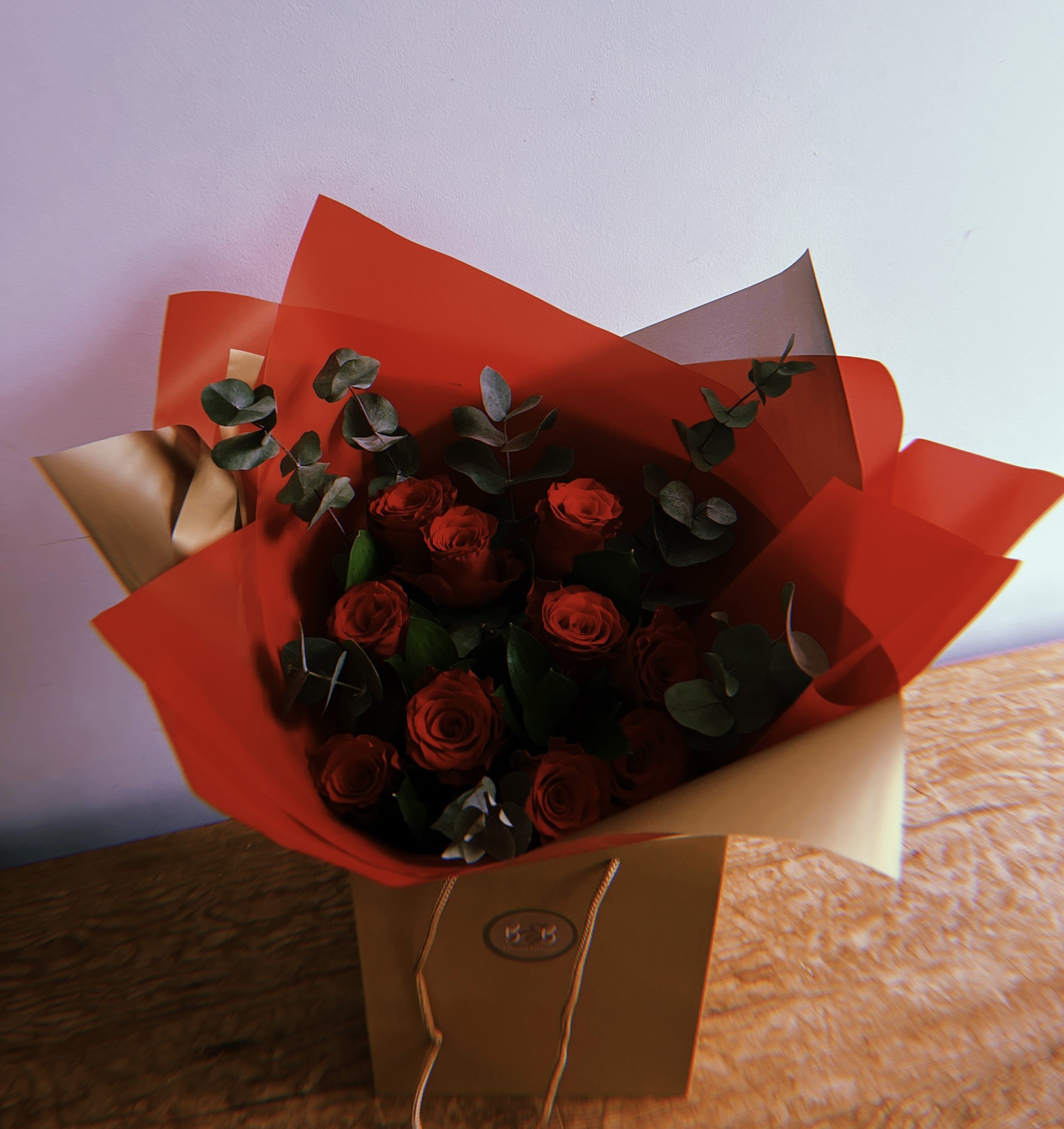 Ten Red Freedom roses and foliage make up this beautiful bouquet, a perfect gift for Valentine's Day.