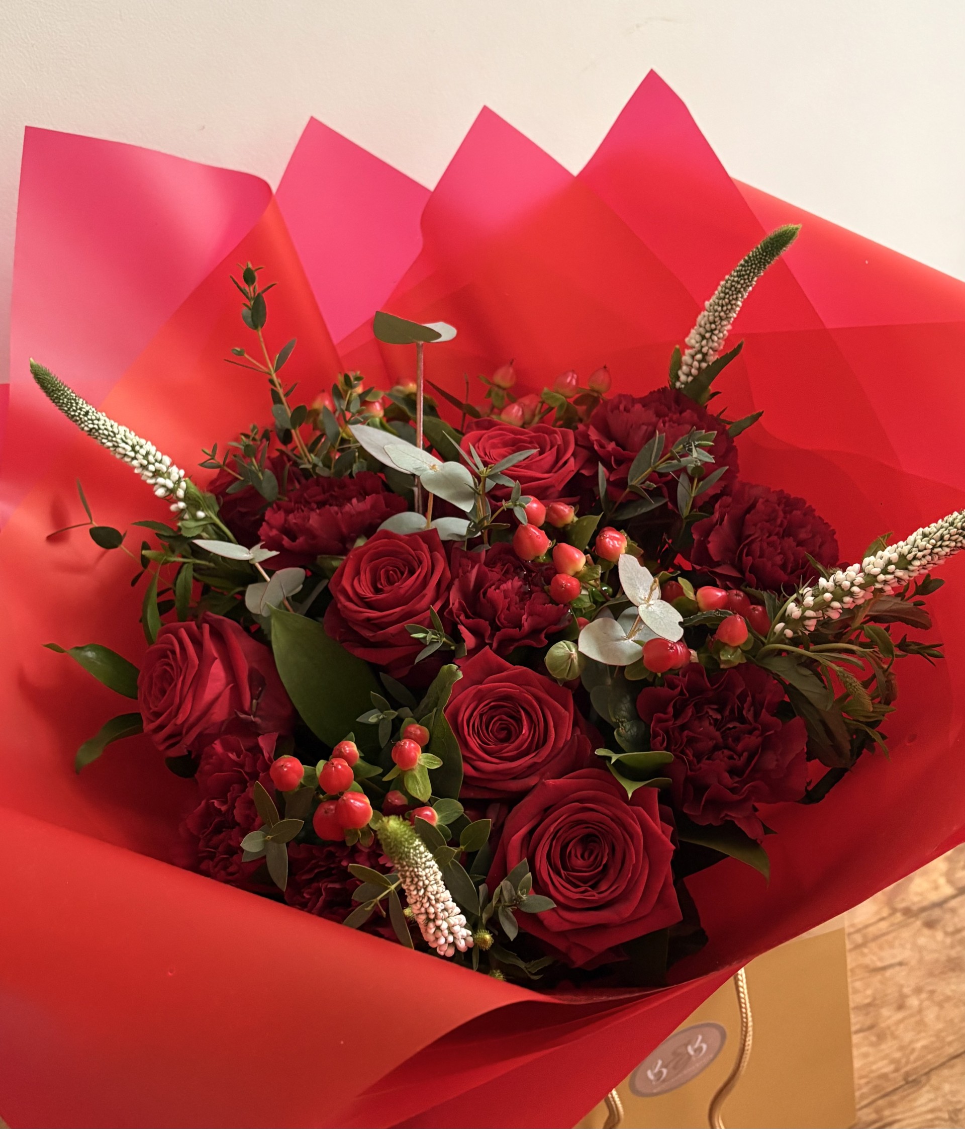 This rich and heavenly bunch is made using red Freedom roses, hypericum, carnations, veronica and foliage, the perfect combination for your Valentine.
